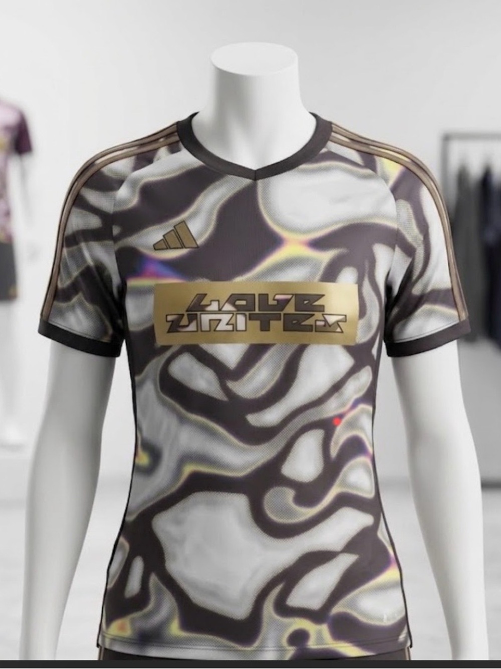 ADIDAS Woman’s LOVE UNITES Metallic Gray & Brown Graphic Performance Shirt